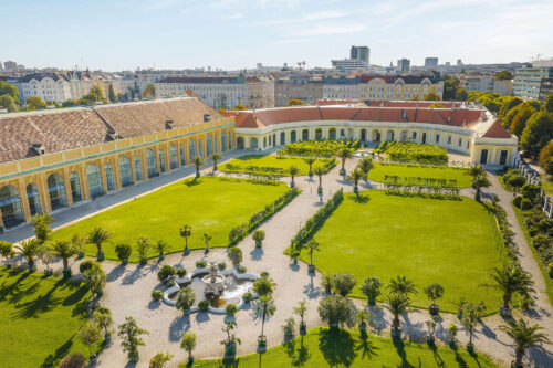 A bird’s-eye view of the orangery with plants and palm trees